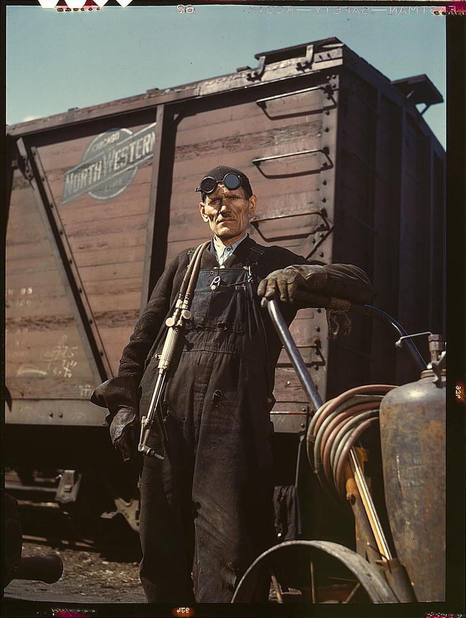 Welder Mike Evans at Proviso yard of the Chicago and Northwest Railway Company Chicago IL April 1943 Photo by Jack Delano Prints and Photographs Division, Library of Congress
